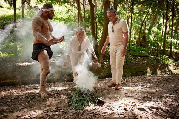 An authentic Welcome to Country Ceremony with guests at Bronte Gully in Sydney