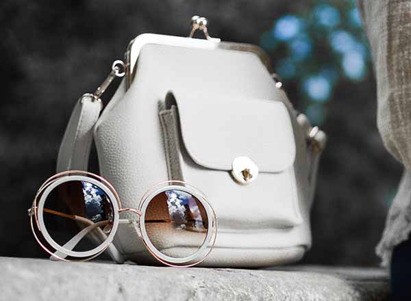 A handbag and fashion sunglasses